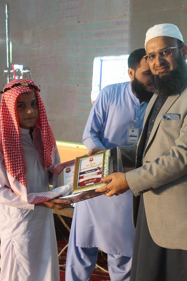 Person sitting in a modern building with a scenic view